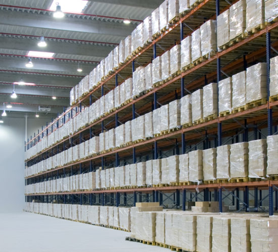 Aisles of a warehouse and products on racking, all of which can be insured with Insure 313 insurance brokers.