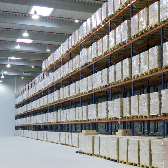 Aisles of a warehouse and products on racking, all of which can be insured with Insure 313 insurance brokers.